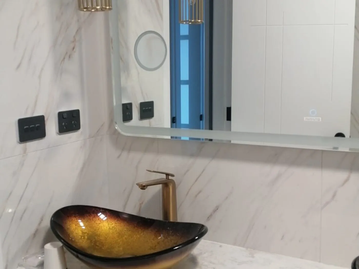 Marsden Park ensuite after renovation with double gold vessel basins and marble-look walls